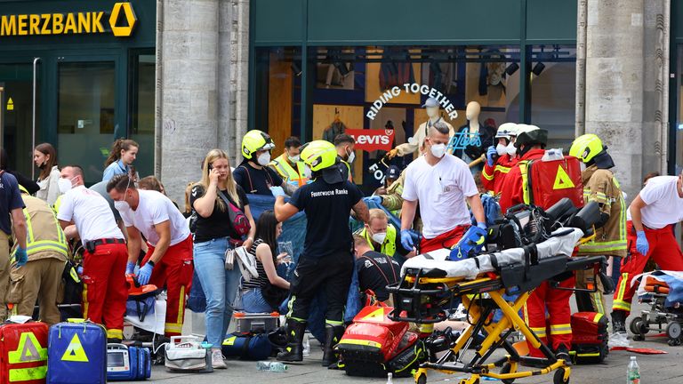 First responders assist the injured, after a car crashed into a group of people at Tauentzienstrasse in Berlin, Germany June 8, 2022. REUTERS/Fabrizio Bensch
