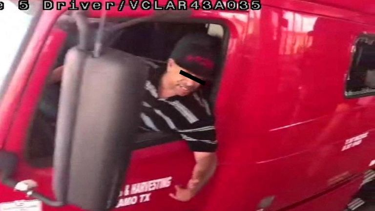 The alleged driver of a truck carrying dozens of migrants, identified by Mexican immigration officials as "Homero N", drives through a security checkpoint in this surveillance photograph in Laredo, Texas, in this handout photo distributed to Reuters on June 29, 2022. INM - National Institute of Migration/Handout via REUTERS ATTENTION EDITORS - THIS IMAGE WAS PROVIDED BY A THIRD PARTY. NO RESALES. NO ARCHIVES. EYES MASKED AT SOURCE
