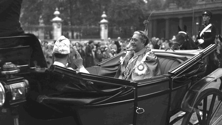 Queen Salote Tupou III of Tonga rides through the streets of London in an open carriage during the Queen's coronation parade in 1953. Pic: AP