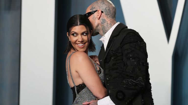 Kourtney Kardashian and Travis Barker arrive at the Vanity Fair Oscar party during the 94th Academy Awards in Beverly Hills, California, U.S., March 27, 2022. REUTERS/Danny Moloshok
