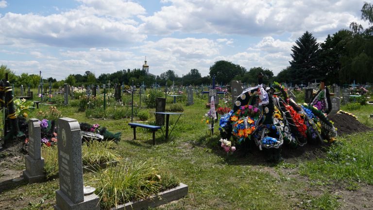 Yurii Berlizov was killed on the first day of the Ukraine war. He was a soldier and the father of nine children. His wife is pregnant with a 10th. His grave is the one with the flowers
