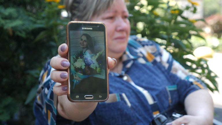 Liudmyla  shows us a photo of her missing 22-year-old daughter, Tetyana