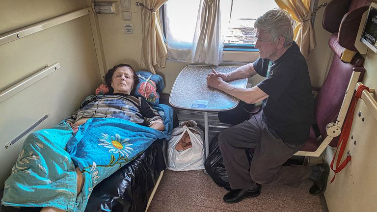 Kateryna and Mykola wait for a train to take them away from east Ukraine