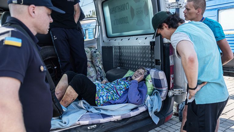 A woman is brought to a station in east Ukraine by ambulance