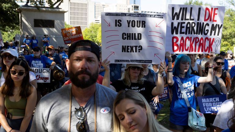 Patrick Farnsworth of Bryan, Texas, and Natalie Allen of Waco, Texas, listen to speeches during a "March for Our Lives" rally, one of a series of nationwide protests against gun violence, in Austin, Texas, U.S. June 11, 2022. REUTERS/Nuri Vallbona
