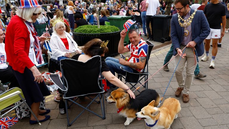Mayor Councillor Richard Edgington walks corgi dogs during celebrations marking the Platinum Jubilee  in Warwick