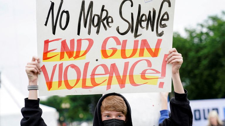  A demonstrator holds a placard while taking part in the March for Our Lives