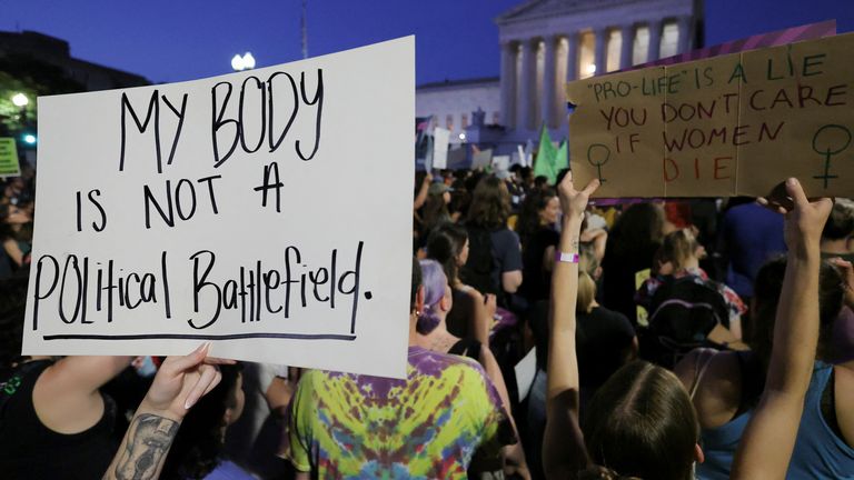 Abortion rights demonstrators protest outside the United States Supreme Court as the court rules in the Dobbs v Women&#39;s Health Organization abortion case, overturning the landmark Roe v Wade abortion decision in Washington, U.S., June 24, 2022. REUTERS/Jim Bourg