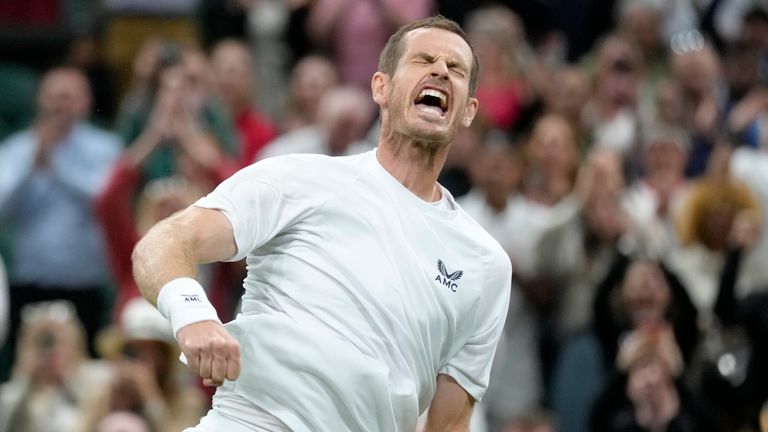 Britain&#39;s Andy Murray celebrates after beating Australia&#39;s James Duckworth in a first round men&#39;s singles match on day one of the Wimbledon tennis championships in London, Monday, June 27, 2022. (AP Photo/Kirsty Wigglesworth)