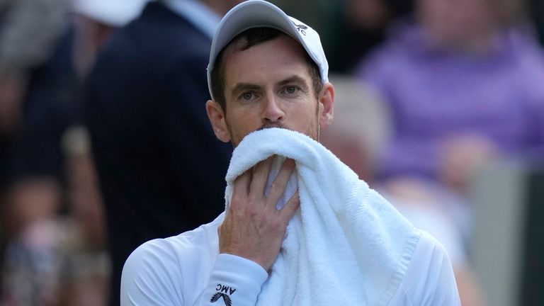 Britain&#39;s Andy Murray wipes his face during a break of the singles tennis match against John Isner of the US on day three of the Wimbledon tennis championships in London, Wednesday, June 29, 2022. (AP Photo/Alastair Grant)