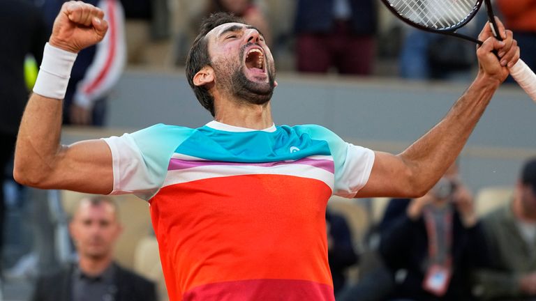 Croatia&#39;s Marin Cilic celebrates winning his quarterfinal match against Russia&#39;s Andrey Rublev in five sets, 5-7, 6-3, 6-4, 3-6, 7-6 (10-2), at the French Open tennis tournament in Roland Garros stadium in Paris, France, Wednesday, June 1, 2022. (AP Photo/Michel Euler)