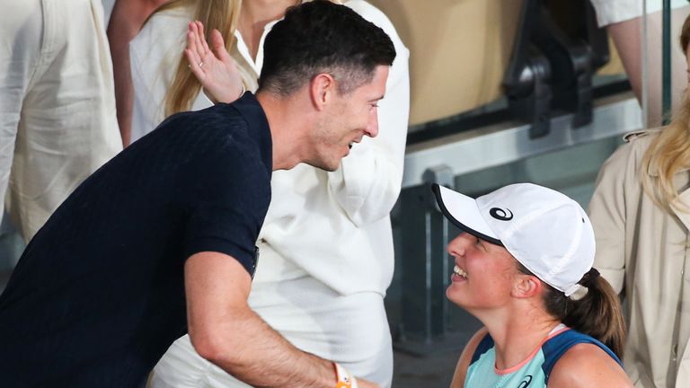 The football player Robert Lewandowski greeting Iga Swiatek after her win against Coco Gauff on Philipe Chatrier court in the 2022 French Open women&#39;s final. (Photo by Ibrahim Ezzat/NurPhoto via Getty Images)