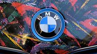 The BMW logo is seen on the bonnet of a colour wrapped vehicle in London, Britain September 30, 2016. REUTERS/Toby Melville
