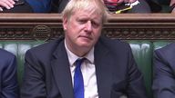 Boris Johnson listens to Sajid Javid statement