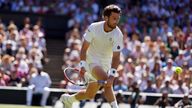 Cameron Norrie in action against Novak Djokovic during the Gentlemen&#39;s Singles Semi Final on day twelve of the 2022 Wimbledon Championships at the All England Lawn Tennis and Croquet Club, Wimbledon. Picture date: Friday July 8, 2022.