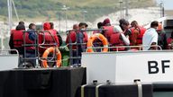 A group of people thought to be migrants being brought into Dover on Thursday