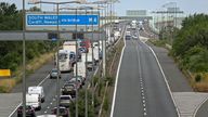 Police escort vehicles across the Prince of Wales Bridge during the morning rush hour as drivers hold a go-slow protest on the M4