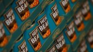 FILE PHOTO: Tins of Heinz Baked Beans rest on a palette in the company&#39;s factory in Wigan, northern England, May 21, 2009. REUTERS/Phil Noble/File Photo
