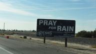A billboard reading "pray for rain" stands on the highway near Teviston, California, U.S., October 22, 2021. Picture taken on October 22, 2021. REUTERS/Stephanie Keith