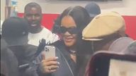 Rihanna filming fans outside the barbershop in Crystal Palace. Pic: Twitter/@tyreeck_112