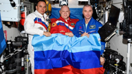Russian cosmonauts with the flag of the Luhansk People's Republic aboard the International Space Station. Pic: Roscosmos