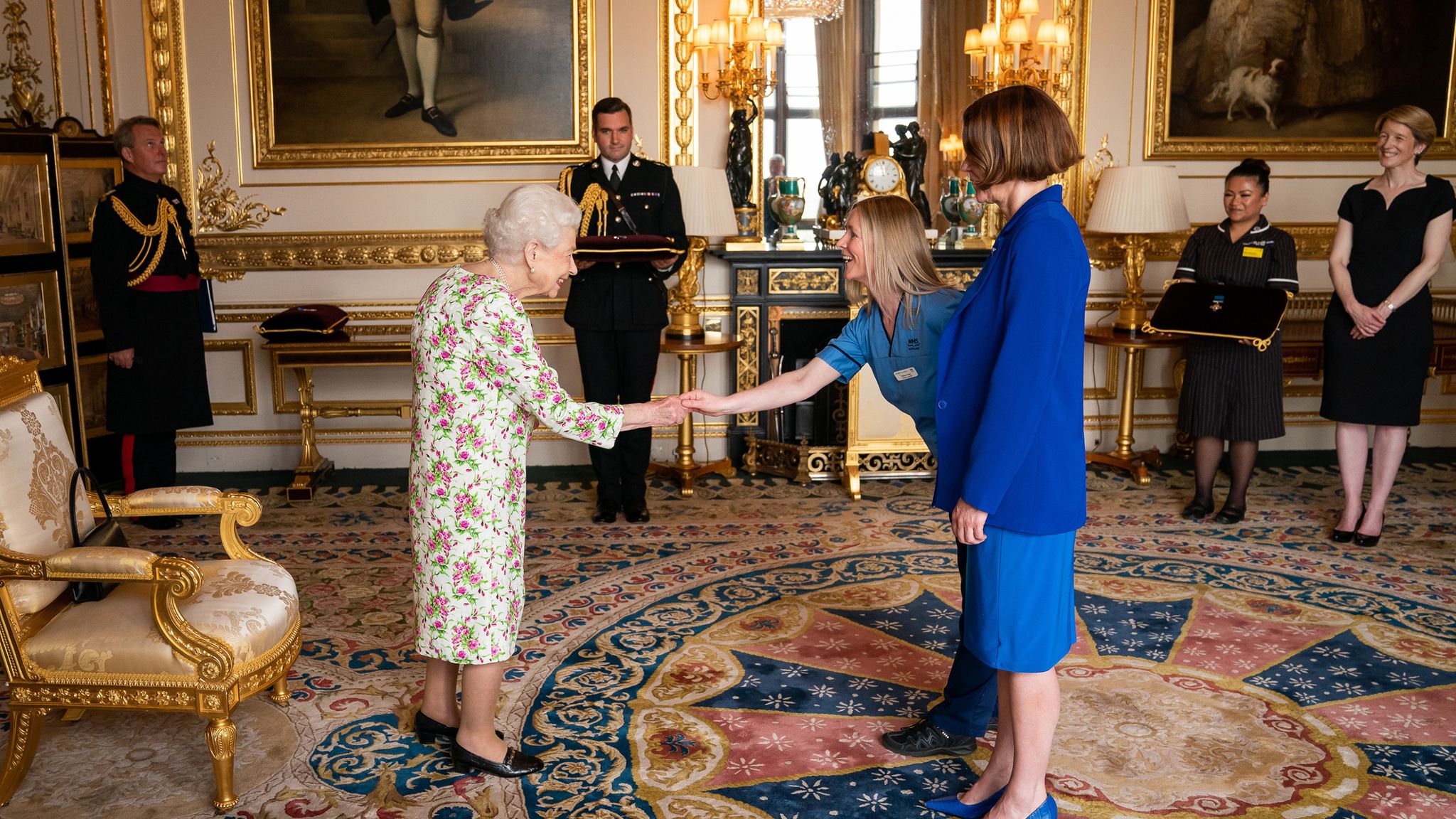Queen jokes with nurses as she awards NHS bosses the George Cross for ...