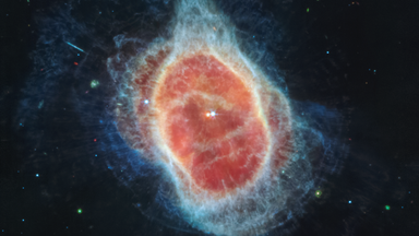 Southern Ring Nebula (MIRI Image)
NASA’s Webb Telescope has revealed the cloak of dust around the second star, shown at left in red, at the center of the Southern Ring Nebula for the first time. It is a hot, dense white dwarf star.