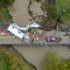 'The worst I've ever seen': Entire homes lifted and moved as deadly flash floods cause devastation