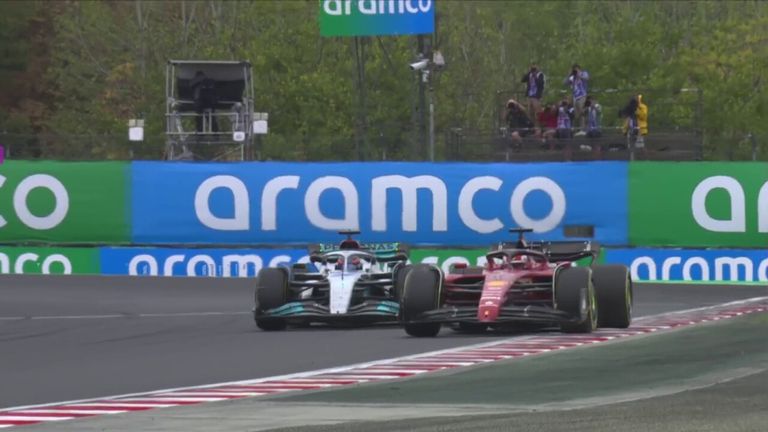 Charles Leclerc passes George Russell for the lead!