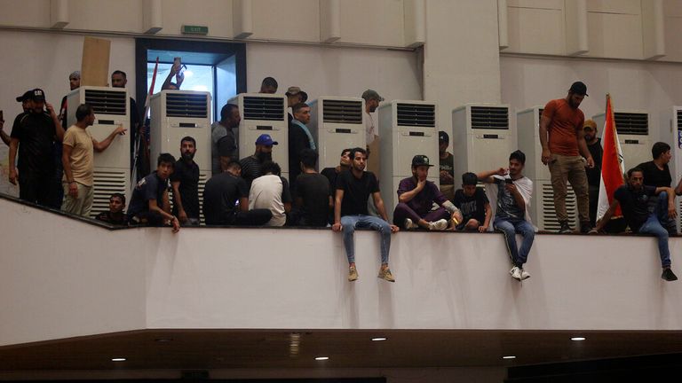 Protesters inside the parliament building in Iraqi capital, Baghdad. Pic: AP 