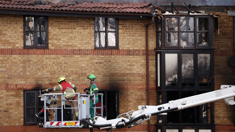 Firefighters work at the scene of a fire at Redwood Grove following a gas explosion, in Bedford, Britain, July 4, 2022. REUTERS/Henry Nicholls
