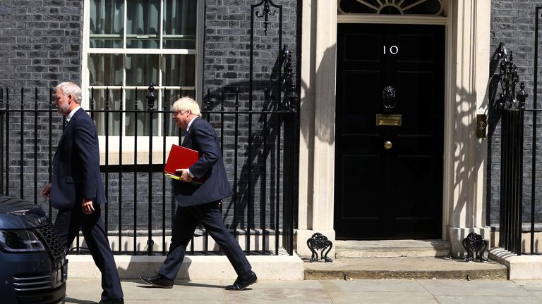 British Prime Minister Boris Johnson walks outside Downing Street in London, Britain, July 20, 2022. REUTERS/Hannah McKay
