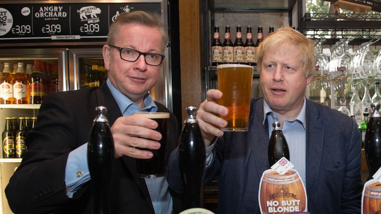 Michael Gove and Boris Johnson (right) pull pints of beer at the Old Chapel pub in Darwen in Lancashire, as part of the Vote Leave EU referendum campaign.