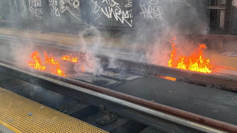 Flames rise from a railway bridge in Battersea, London.  Pic: Network Rail