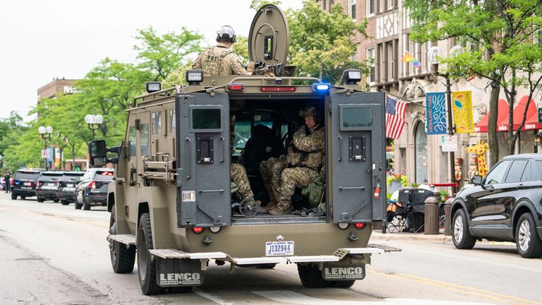 An FBI tactical team arrives on the scene after a mass shooting at a July 4th parade in Highland Park