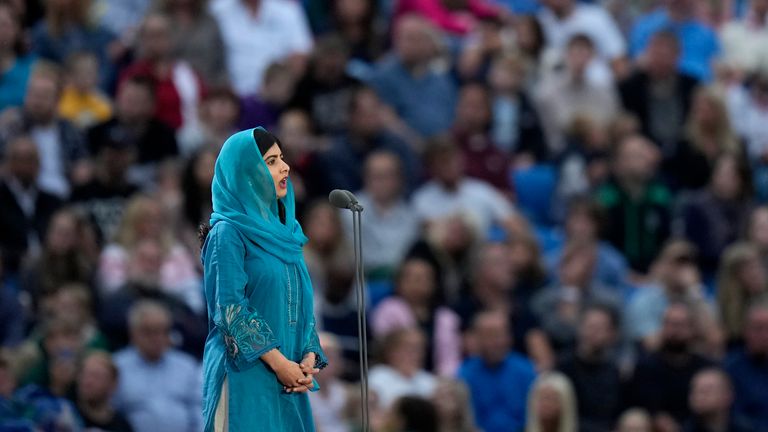 Pakistani activist Malala Yousafzai addresses the crowd during the Commonwealth Games opening ceremony at the Alexander stadium in Birmingham, England, Thursday, July 28, 2022. (AP Photo/Alastair Grant)