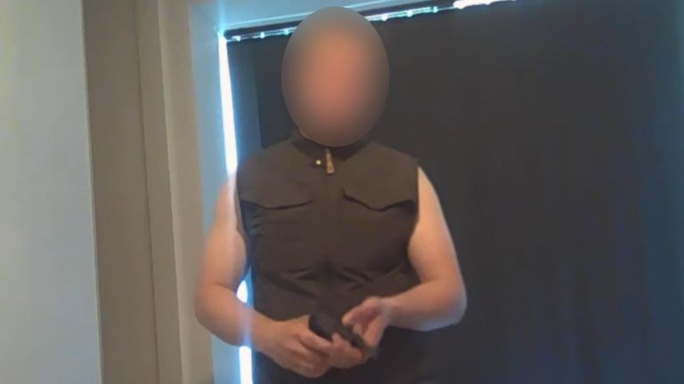 The suspect holding a gun in the YouTube video he uploaded the day before the shooting