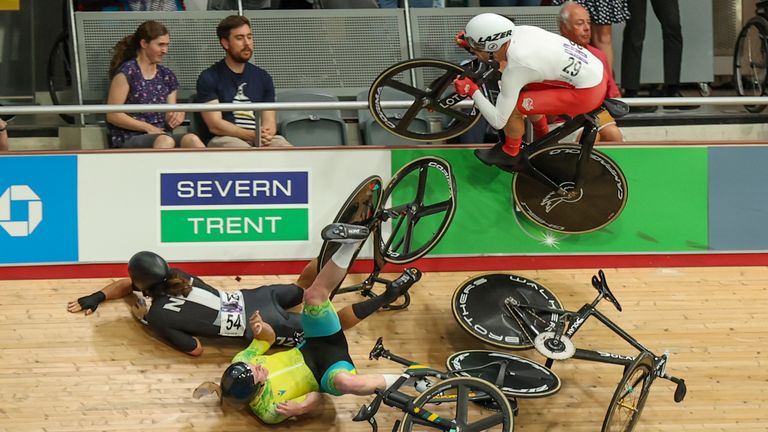 Riders crash on the final lap in the men&#39;s 15km scratch race qualifying during the Commonwealth Games track cycling at Lee Valley VeloPark in London, Sunday, July 31, 2022. (AP Photo/Ian Walton)