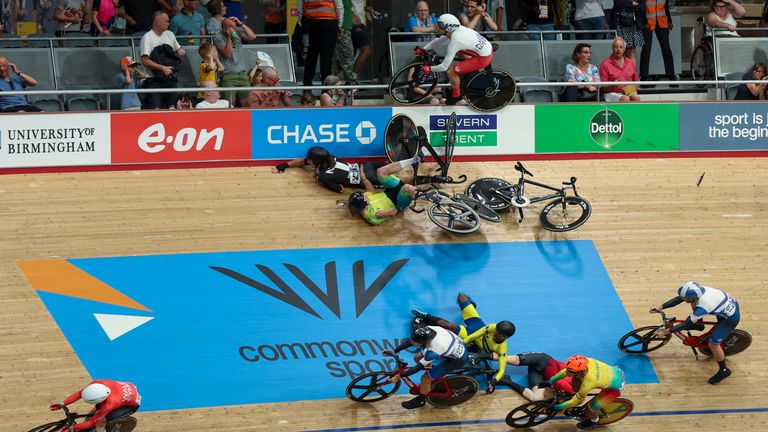 Riders crash on the final lap in the men&#39;s 15km scratch race qualifying during the Commonwealth Games track cycling at Lee Valley VeloPark in London, Sunday, July 31, 2022. (AP Photo/Ian Walton)