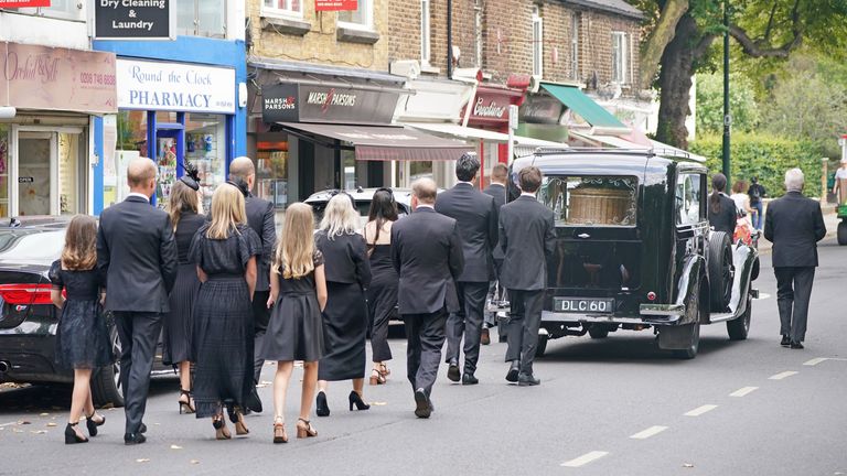Dame Deborah James’s husband and son carry cancer campaigner’s coffin at funeral