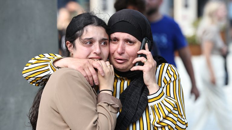 People react outside the Field shopping center, after Danish police said they received a report of a shooting, in Copenhagen, Denmark, July 3, 2022. Ritzau Scanpix / Olafur Steinar Gestsson via REUTERS ATTENTION EDITORS - THIS IMAGE IS SUPPLIED A THIRD PARTY.  OUTSIDE DENMARK.  NO COMMERCIAL SALES OR EDITING IN DENMARK.