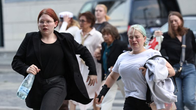 People leave Field&#39;s shopping centre, after Danish police said they received reports of shooting, in Copenhagen, Denmark, July 3, 2022. Ritzau Scanpix/Olafur Steinar Gestsson via REUTERS ATTENTION EDITORS - THIS IMAGE WAS PROVIDED BY A THIRD PARTY. DENMARK OUT. NO COMMERCIAL OR EDITORIAL SALES IN DENMARK.
