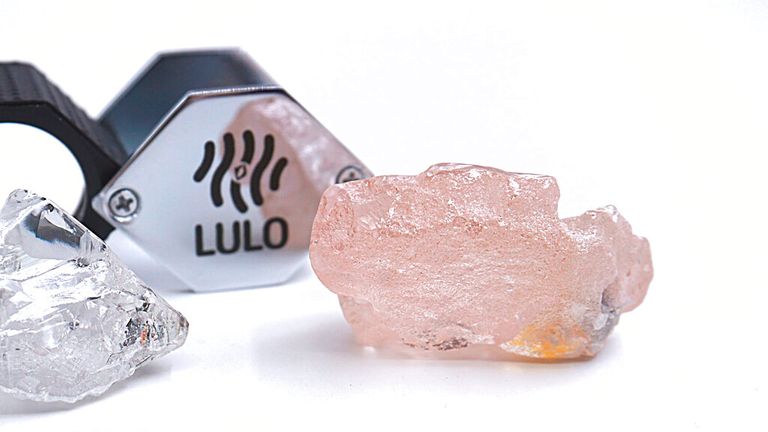 This photo supplied by Lucapa Diamond Company on Wednesday, July 27, 2022, shows the 170 carat pink diamond, right, recovered from Lulo, Angola. A big pink diamond of 170 carats has been discovered in Angola and is claimed to be the largest such gemstone found in 300 years. Called the ...Lulo Rose,... the diamond was found at the Lulo alluvial diamond mine. The mine...s owner, the Lucapa Diamond Company, on Wednesday announced the discovery of the large pink diamond on its website. (Lucapa Diamond Company via AP)