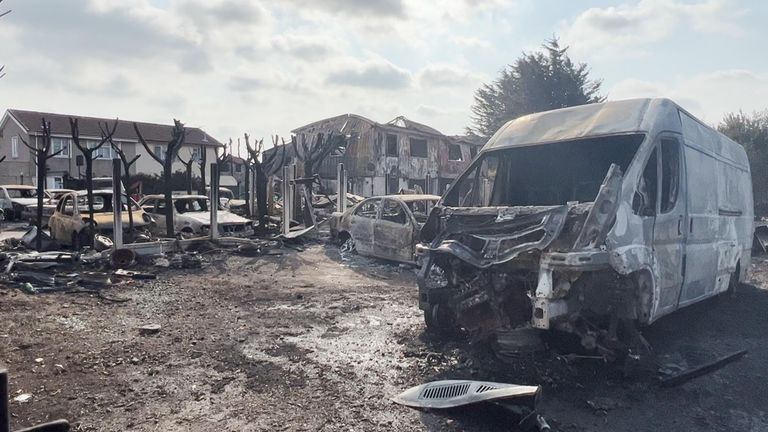 A burned out van in Dagenham after grass fires