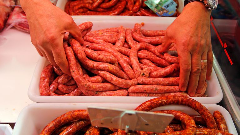 A butcher arranges pieces of sausage at his shop in Marseille, France, October 27, 2015. Eating processed meats like hot dogs, sausages and bacon can cause colorectal cancer in humans, and red meat is also a likely cause of the disease, World Health Organization (WHO) experts said. The review by WHO&#39;s International Agency for Research on Cancer (IARC), released on Monday, said additionally that there was some link between the consumption of red meat and pancreatic cancer and prostate cancer.