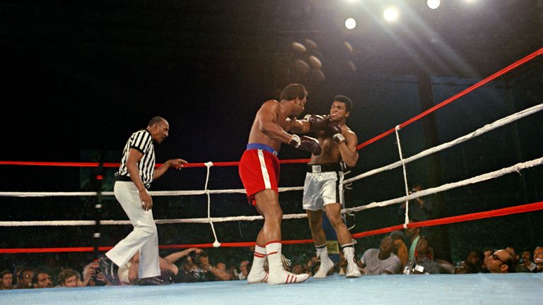 Challenger Muhammad Ali is hit with a left jab by defending world champion George Foreman during the WBA/WBC championship bout in Kinshasa, Zaire, on October 30, 1974. Ali regained the heavyweight crown by knocking out Foreman in the eighth round of their fight dubbed &#39;Rumble in the Jungle.&#39; The referee is Zack Clayton. (AP Photo)