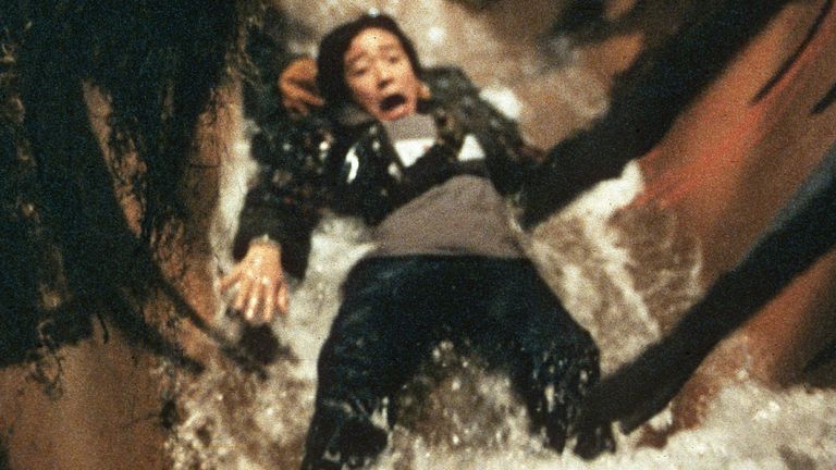 A still from the 1985 movie the Goonies featuring Ke Huy Quan on the film&#39;s famous water slide. Pic: Warner Bros/Kobal/Shutterstock