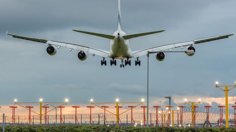 Airplane landing at Heathrow airport in London stock photo