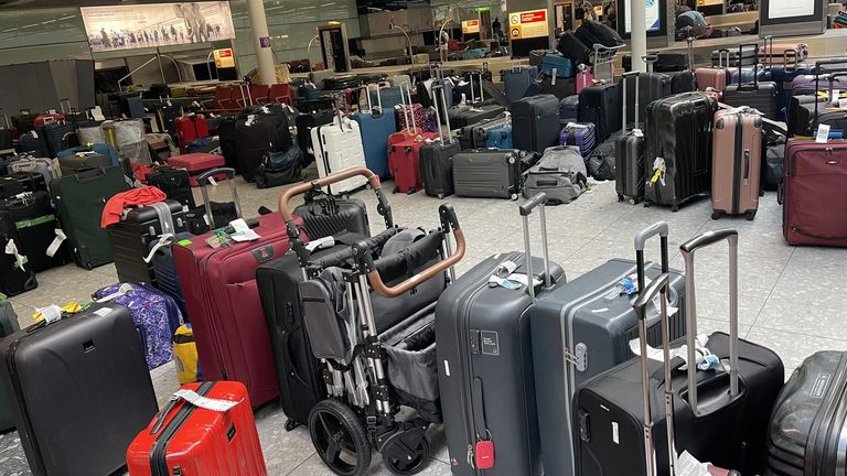 Unclaimed luggage standing in the baggage claim area of Heathrow&#39;s Terminal 3