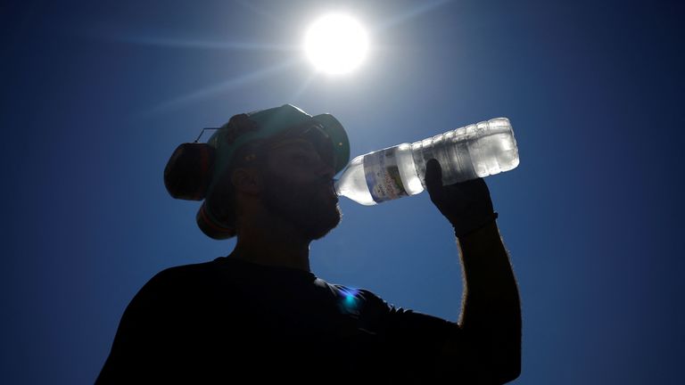 A worker drinks water on a road site in Aigrefeuille-sur-Maine
A worker drinks water on a road site in Aigrefeuille-sur-Maine near Nantes, as a heatwave hits France, July 12, 2022. REUTERS/Stephane Mahe